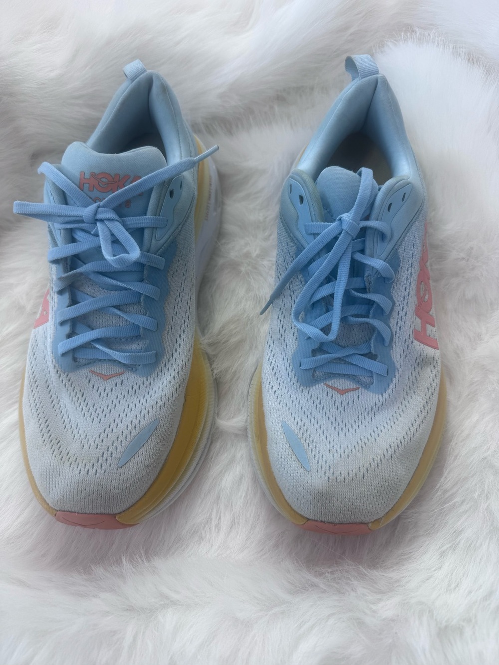 Hoka Men’s Light Blue Running Sneakers with orange and Yellow Accents